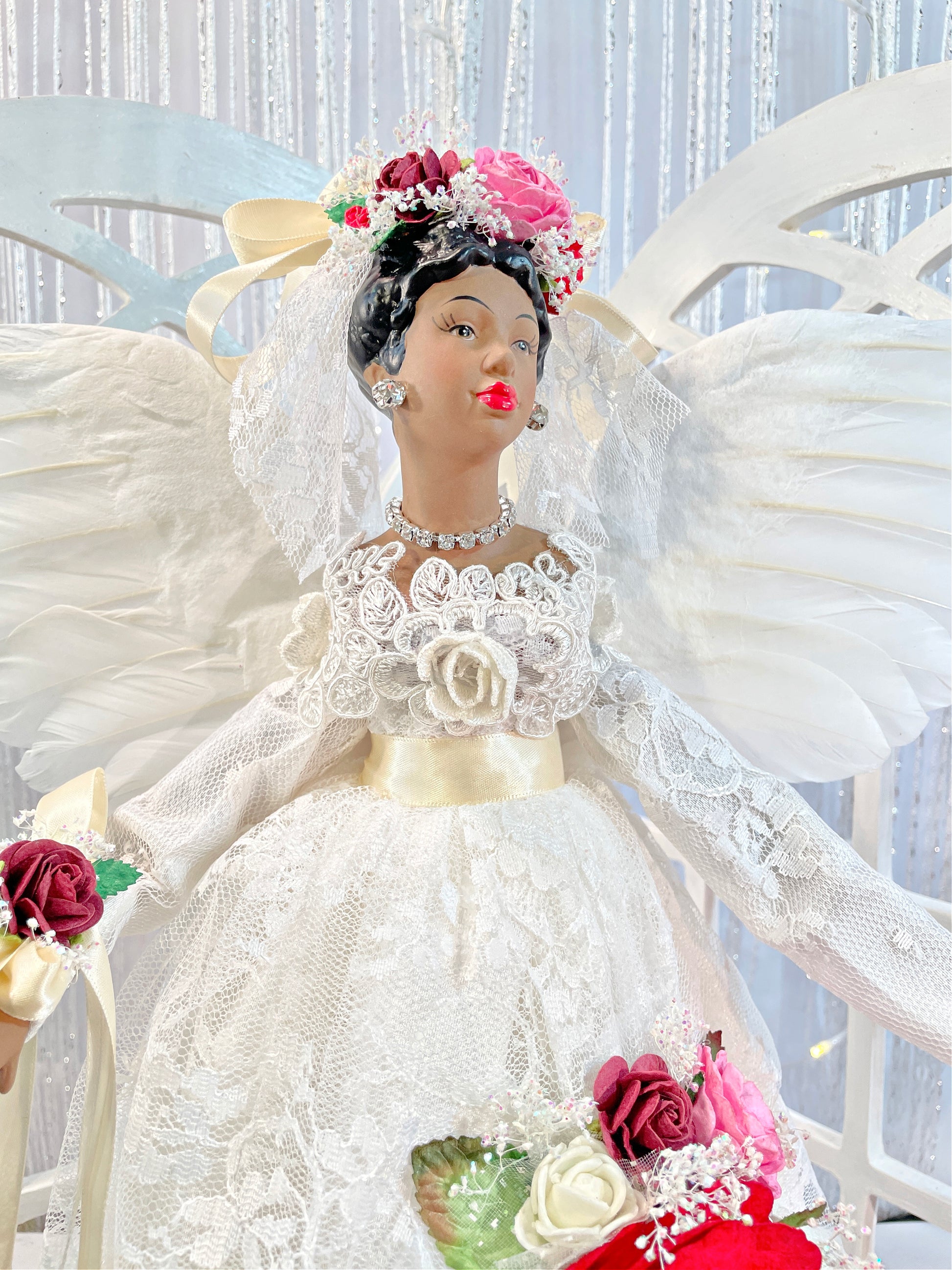 African American Christmas Angel dressed in ivory lace with red and pink floral accents